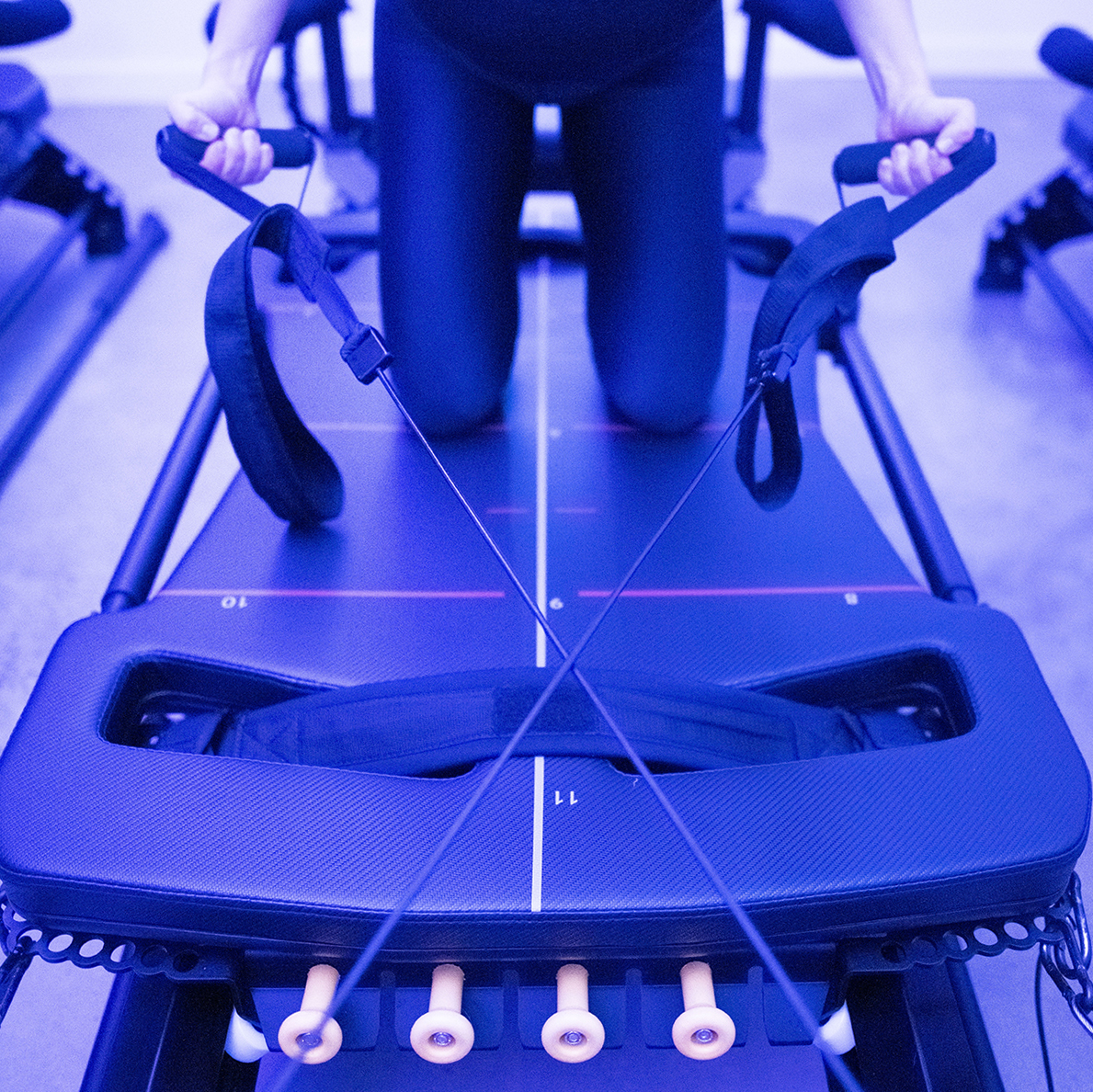 Individual using megaformer machine